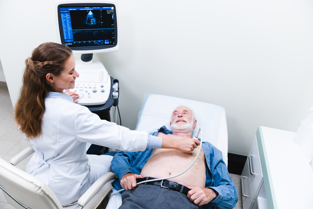 Heart,Ultrasound,Examination,Performed,By,Woman,Doctor,With,Smiling,Aged